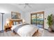 Bright bedroom with wood floors and private balcony at 2037 Linwood Way, Sarasota, FL 34232