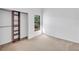 Spacious bedroom with a large closet and neutral carpeting at 2037 Linwood Way, Sarasota, FL 34232