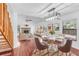 Open concept dining area with hardwood floors and modern lighting at 2037 Linwood Way, Sarasota, FL 34232