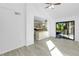 Sunlit living room with sliding doors leading to patio at 2037 Linwood Way, Sarasota, FL 34232