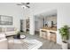 Bright living room with an open floor plan and wood-look flooring at 2037 Linwood Way, Sarasota, FL 34232