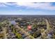 Aerial view of the home and surrounding neighborhood near a body of water at 207 Santarem Cir, Punta Gorda, FL 33983