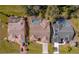 Three homes with pools and solar panels visible from above at 207 Santarem Cir, Punta Gorda, FL 33983