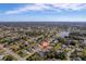 Wide shot of a home situated in a residential neighborhood at 207 Santarem Cir, Punta Gorda, FL 33983