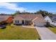 Aerial view of a single-Gathering home with a large yard and neighborhood at 207 Santarem Cir, Punta Gorda, FL 33983