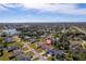 Aerial view showing home's location in a residential neighborhood near a lake at 207 Santarem Cir, Punta Gorda, FL 33983