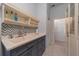 Laundry room with sink, cabinets, and a tiled floor at 207 Santarem Cir, Punta Gorda, FL 33983