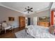 Main bedroom featuring wood floors, an armoire, and ample natural light at 207 Santarem Cir, Punta Gorda, FL 33983