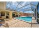 Relaxing screened pool area with paver deck at 207 Santarem Cir, Punta Gorda, FL 33983