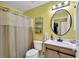 Clean bathroom with a toilet, vanity, and shower/tub combo at 2207 22Nd W St, Bradenton, FL 34205