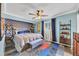 Spacious bedroom with a king-size bed and geometric patterned wall at 2207 22Nd W St, Bradenton, FL 34205