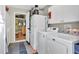 Bright laundry room featuring washer, dryer, and cabinets at 2207 22Nd W St, Bradenton, FL 34205