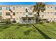 Ground floor condo patio with seating area and grassy yard at 2459 Franciscan Dr # 5, Clearwater, FL 33763