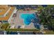 Resort-style pool with plenty of lounge chairs and umbrellas at 2459 Franciscan Dr # 5, Clearwater, FL 33763