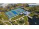 Aerial view of tennis and pickleball courts, plus a covered pavilion at 2459 Franciscan Dr # 5, Clearwater, FL 33763