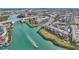 Aerial view of waterfront community, showcasing boat and lush landscape at 250 Santa Maria St # 120, Venice, FL 34285