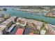 Aerial view of condo building with parking and marina views at 250 Santa Maria St # 120, Venice, FL 34285