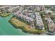 Aerial view of waterfront condo community, showing landscaping and boat access at 250 Santa Maria St # 120, Venice, FL 34285