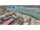 Aerial view of condo building with parking and marina views at 250 Santa Maria St # 120, Venice, FL 34285