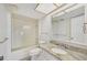 Clean bathroom with granite vanity and a bathtub at 250 Santa Maria St # 120, Venice, FL 34285