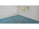 Bright bedroom with blue carpet and window with blinds at 250 Santa Maria St # 120, Venice, FL 34285