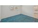 Bedroom with blue carpet and kitchen view at 250 Santa Maria St # 120, Venice, FL 34285