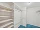 Large closet with shelves and hanging rods for storage at 250 Santa Maria St # 120, Venice, FL 34285