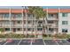 Condo building exterior showcasing multiple units and parking at 250 Santa Maria St # 120, Venice, FL 34285