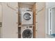 Laundry closet with stacked washer and dryer at 250 Santa Maria St # 120, Venice, FL 34285