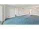 Living room with blue carpet and access to other rooms at 250 Santa Maria St # 120, Venice, FL 34285