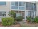 Ground level patio with water view and landscaping at 250 Santa Maria St # 120, Venice, FL 34285