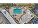 Community pool with surrounding lounge chairs and patio area at 250 Santa Maria St # 120, Venice, FL 34285