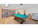 Community recreation room with billiards table and extensive library at 250 Santa Maria St # 120, Venice, FL 34285