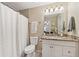 Clean bathroom with granite countertop and white vanity at 2551 Morrietta Ln, North Port, FL 34286