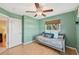 Light and airy bedroom with a daybed and built-in shelving at 2551 Morrietta Ln, North Port, FL 34286