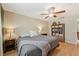 King bedroom with ceiling fan and plenty of closet space at 2551 Morrietta Ln, North Port, FL 34286