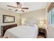 Comfortable bedroom with ceiling fan and ample natural light at 2551 Morrietta Ln, North Port, FL 34286