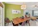 Dining area with a wood table and six leather chairs at 2551 Morrietta Ln, North Port, FL 34286