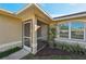 Screened-in front porch with access to the front door at 2551 Morrietta Ln, North Port, FL 34286
