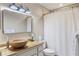 Modern bathroom with a wood-look vanity and a large mirror at 2728 71St Street W Ct # 2078, Bradenton, FL 34209