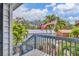 Small deck overlooking the backyard with gray railing at 2728 71St Street W Ct # 2078, Bradenton, FL 34209