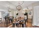 Bright dining area with wood floors and a charming round table at 2728 71St Street W Ct # 2078, Bradenton, FL 34209