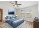 Bright bedroom with large windows, hardwood floors, and a ceiling fan at 284 Crew Ct, Sarasota, FL 34243