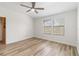 Spacious bedroom with wood-look floors and ceiling fan at 284 Crew Ct, Sarasota, FL 34243