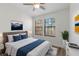 Spacious bedroom with a bed, hardwood floors, and windows at 284 Crew Ct, Sarasota, FL 34243