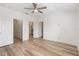 Bright bedroom with wood-look flooring and ceiling fan at 284 Crew Ct, Sarasota, FL 34243