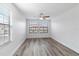 Bright bedroom with wood-look floors and large windows at 284 Crew Ct, Sarasota, FL 34243