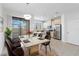 Bright dining area with marble table and modern lighting at 284 Crew Ct, Sarasota, FL 34243