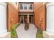 Townhome entry with walkway and lush landscaping at 284 Crew Ct, Sarasota, FL 34243