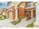 Townhome exterior with double garage and arched entryway at 284 Crew Ct, Sarasota, FL 34243